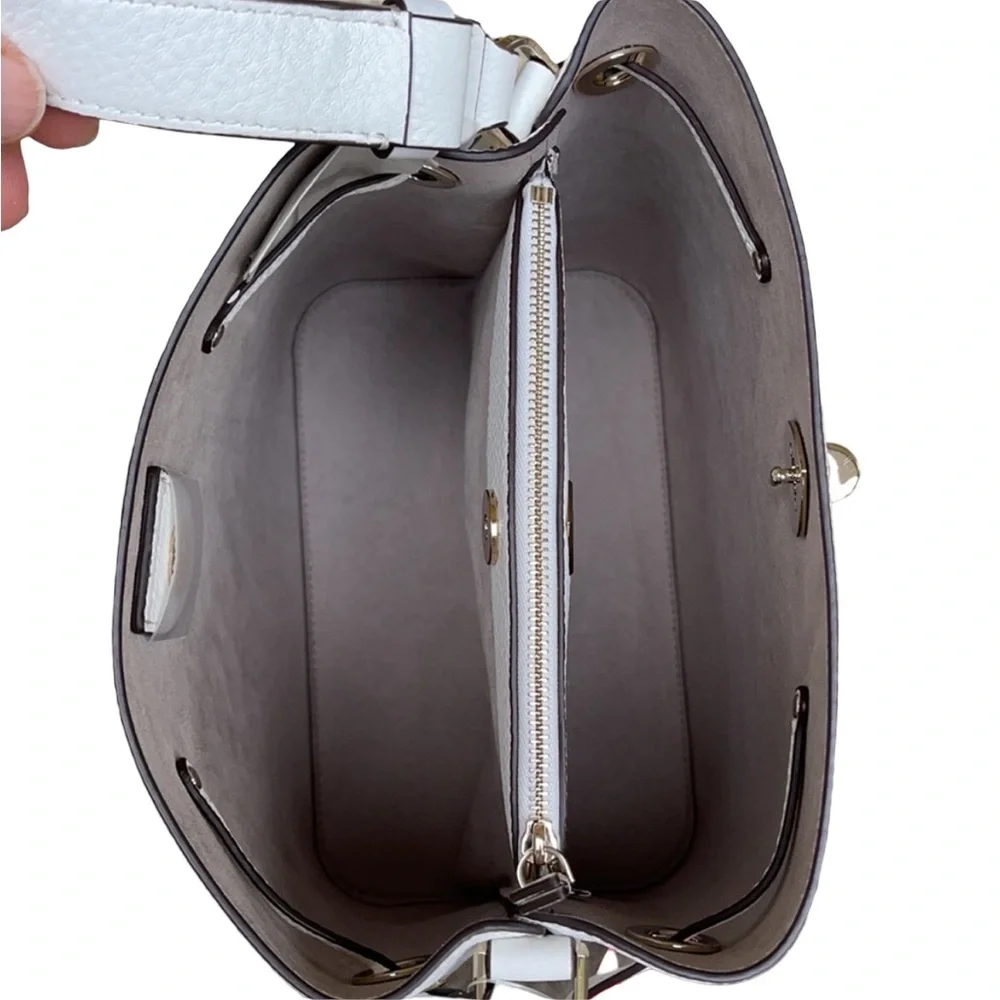 Kate Spade New York Marti large bucket bag in white pebbled leather.